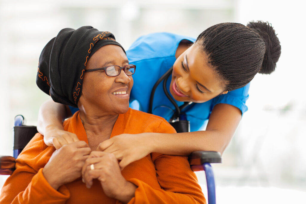 caregiver helping old woman in loss of autonomy